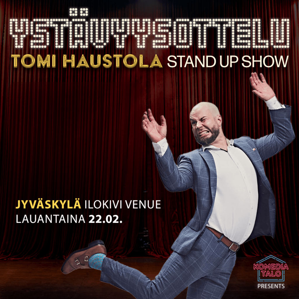 Ystävyysottelu Tomi Haustola stand up show 22.02.2025. Jyväskylä Ilokivi Venue Kuvassa Tomi Haustola hyppäämässä ja irvistämässä lavalla.